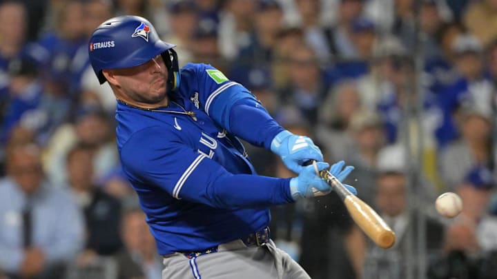 Oct 27, 2025; Los Angeles, California, USA; Toronto Blue Jays first baseman Ty France (2) hits a single against the Los Angeles Dodgers in the tenth inning during game three of the 2025 MLB World Series at Dodger Stadium. Mandatory Credit: Jayne Kamin-Oncea-Imagn Images