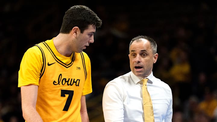 Iowa head coach Ben McCollum instructs Iowa forward Alvaro Folgueiras (7) during a basketball game against the Ohio State Buckeyes Feb. 25, 2026 at Carver-Hawkeye Arena in Iowa City, Iowa.