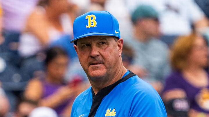 Jun 16, 2025; Omaha, Neb, USA; UCLA Bruins head coach John Savage walks off the field before the game against the LSU Tigers at Charles Schwab Field. Mandatory Credit: Dylan Widger-Imagn Images
