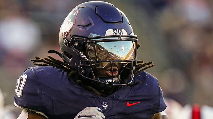 Sep 20, 2025; East Hartford, Connecticut, USA; Connecticut Huskies running back Cam Edwards (0) runs the ball for a touchdown against et Ball State Cardinals in the second half at Pratt & Whitney Stadium at Rentschler Field.