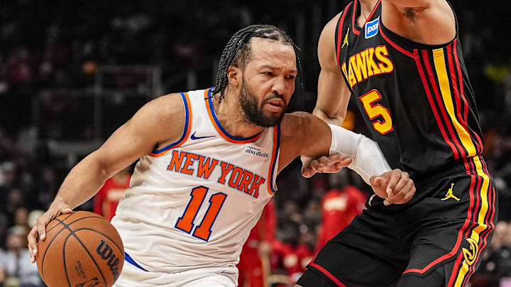 Apr 6, 2026; Atlanta, Georgia, USA; New York Knicks guard Jalen Brunson (11) dribbles against Atlanta Hawks guard Dyson Daniels (5) during the first half at State Farm Arena.
