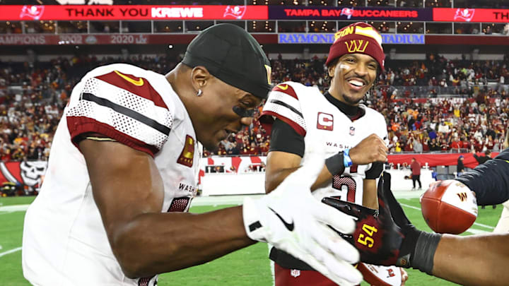 Jan 12, 2025; Tampa, Florida, USA; Washington Commanders quarterback Jayden Daniels (5) celebrates with wide receiver Terry McLaurin (17) and linebacker Bobby Wagner (54) after winning a NFC wild card playoff against the Tampa Bay Buccaneers at Raymond James Stadium. Mandatory Credit: Kim Klement Neitzel-Imagn Images