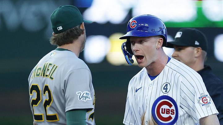 Jun 2, 2026; Chicago, Illinois, USA; Chicago Cubs center fielder Pete Crow-Armstrong (4) reacts after stealing second base against Athletics second baseman Jeff McNeil (22)during the first inning at Wrigley Field. Mandatory Credit: Kamil Krzaczynski-Imagn Images