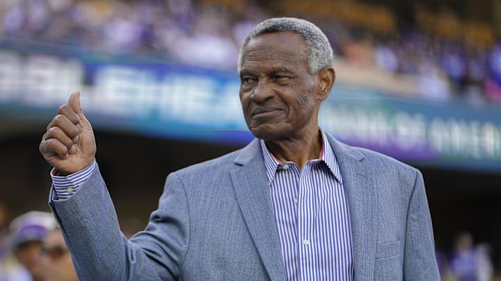 Apr 29, 2023; Los Angeles, California, USA; Los Angeles Dodgers broadcaster and former player Manny Mota greets fans prior to being inducted into the  Legends of Dodger Baseball  pregame ceremony before a game against the St. Louis Cardinals at Dodger Stadium. 