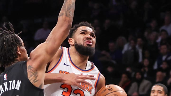 Jan 21, 2025; Brooklyn, New York, USA; New York Knicks center Karl-Anthony Towns (32) looks to drive past Brooklyn Nets center Nic Claxton (33) in the second quarter at Barclays Center. Mandatory Credit: Wendell Cruz-Imagn Images Jan 21, 2025; Brooklyn, New York, USA; New York Knicks center Karl-Anthony Towns (32) looks to drive past Brooklyn Nets center Nic Claxton (33) in the second quarter at Barclays Center. Mandatory Credit: Wendell Cruz-Imagn Images