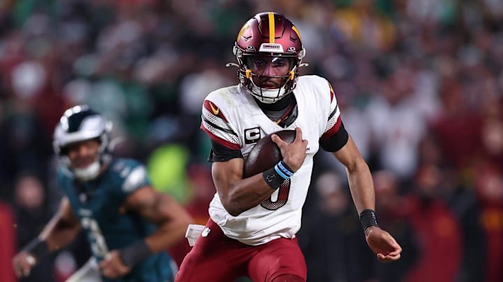 Washington Commanders quarterback Jayden Daniels runs with the ball against the Philadelphia Eagles. Washington Commanders quarterback Jayden Daniels runs with the ball against the Philadelphia Eagles.