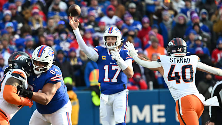 Jan 12, 2025; Orchard Park, New York, USA; Buffalo Bills quarterback Josh Allen (17) throws downfield as Denver Broncos linebacker Justin Strnad (40) defends during the third quarter in an AFC wild card game at Highmark Stadium.