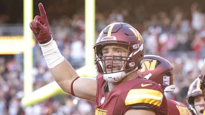Oct 20, 2024; Landover, Maryland, USA; Washington Commanders tight end Zach Ertz (86) celebrates with fans in the stands after scoring a touchdown during the second quarter against the Carolina Panthers at Northwest Stadium. Mandatory Credit: Amber Searls-Imagn Images