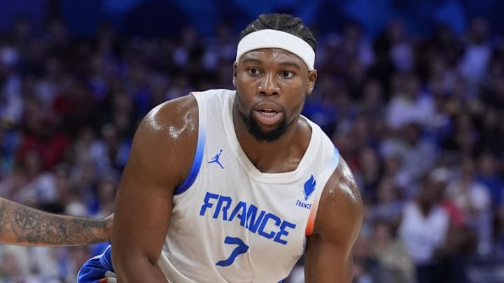 Jul 27, 2024; Villeneuve-d'Ascq, France; France power forward Guerschon Yabusele (7) controls the ball against Brazil during the Paris 2024 Olympic Summer Games at Stade Pierre-Mauroy. Mandatory Credit: John David Mercer-Imagn Images