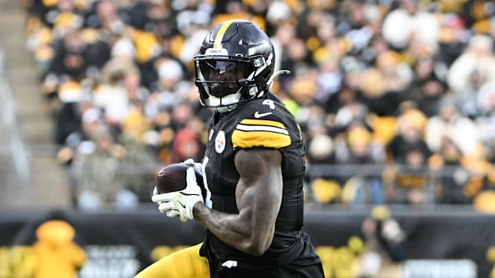 Nov 16, 2025; Pittsburgh, Pennsylvania, USA; Pittsburgh Steelers wide receiver DK Metcalf (4) runs with the ball after a catch against the Cincinnati Bengals during the second half at Acrisure Stadium. Mandatory Credit: Barry Reeger-Imagn Images
