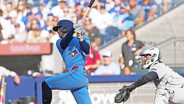 Aug 15, 2026; Toronto, Ontario, CAN; Toronto Blue Jays pinch hitter and second baseman Ernie Clement (22) hits a single against the New York Yankees during the eighth inning at Rogers Centre. Mandatory Credit: Nick Turchiaro-Imagn Images
