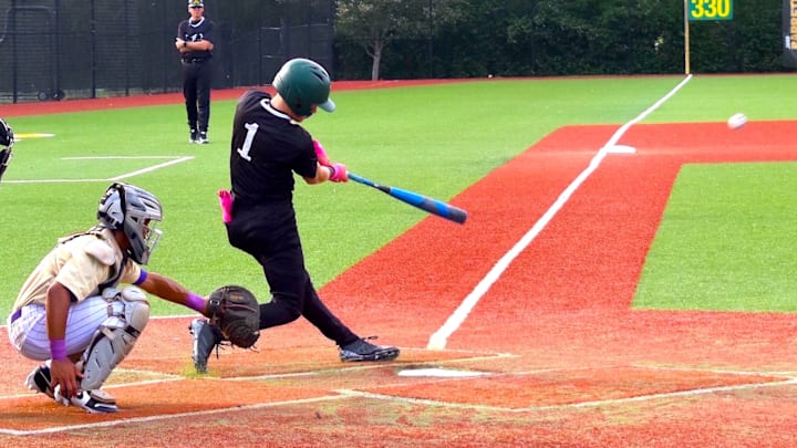 St. Xavier High School player Jaxon Coomer puts the ball in play during a game against Seventh Region rival Male High School April 15, 2026.