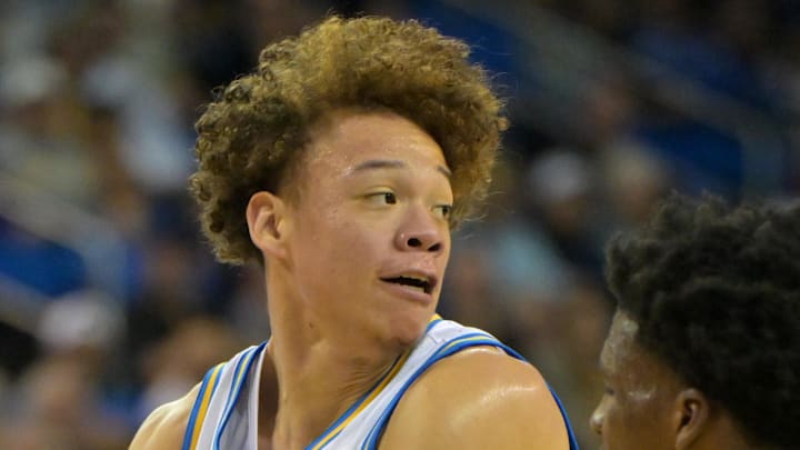 Jan 24, 2026; Los Angeles, California, USA; UCLA Bruins guard Trent Perry (0) is defended by Northwestern Wildcats guard Jordan Clayton (11) in the first half at Pauley Pavilion presented by Wescom Financial. Mandatory Credit: Jayne Kamin-Oncea-Imagn Images