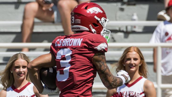 Apr 25, 2026; Fayetteville, AR, USA; Arkansas Razorbacks wide receiver CJ Brown (3) jumps over defensive back Landon Phipps (32) and goes on to score a touchdown during the spring game at Donald W. Reynolds Razorback Stadium. Mandatory Credit: Brett Rojo-Imagn Images Apr 25, 2026; Fayetteville, AR, USA; Arkansas Razorbacks wide receiver CJ Brown (3) jumps over defensive back Landon Phipps (32) and goes on to score a touchdown during the spring game at Donald W. Reynolds Razorback Stadium. Mandatory Credit: Brett Rojo-Imagn Images
