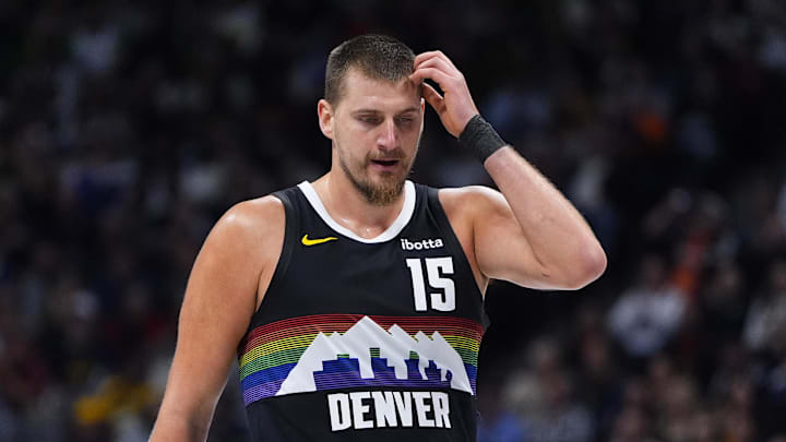 Nov 17, 2025; Denver, Colorado, USA; Denver Nuggets center Nikola Jokic (15) reacts in the second quarter against the Chicago Bulls at Ball Arena. Mandatory Credit: Ron Chenoy-Imagn Images
