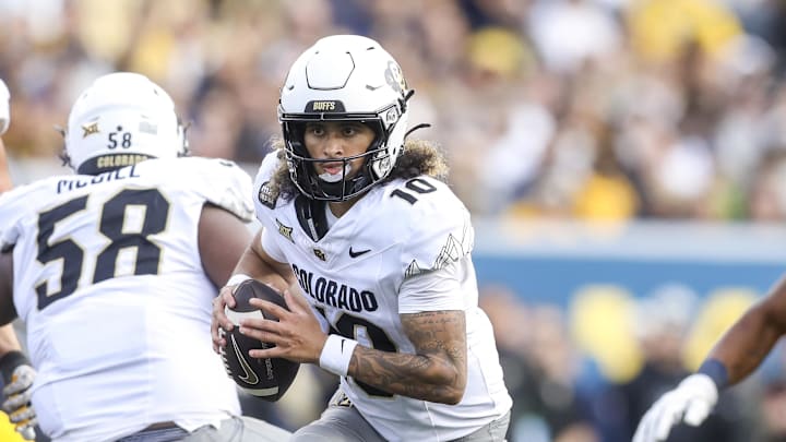 Nov 8, 2025; Morgantown, West Virginia, USA; Colorado Buffaloes quarterback Julian Lewis (10) runs out of the pocket during the third quarter against the West Virginia Mountaineers at Milan Puskar Stadium. Mandatory Credit: Ben Queen-Imagn Images