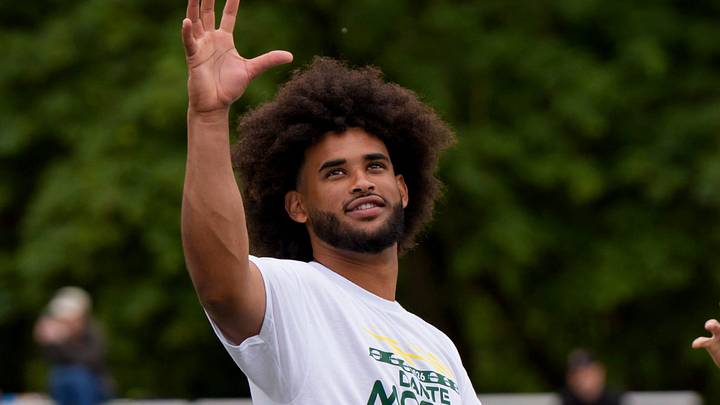 Oregon quarterback Dante Moore catches a pass during a youth football camp at Marist Catholic High School on June 20, 2026, in Eugene, Oregon.