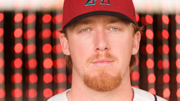 Feb 18, 2026; Scottsdale, AZ, USA; Arizona Diamondbacks pitcher Grant Holman (92) poses for a photo for MLB media day at Salt River Fields at Talking Stick. Mandatory Credit: Allan Henry-Imagn Images