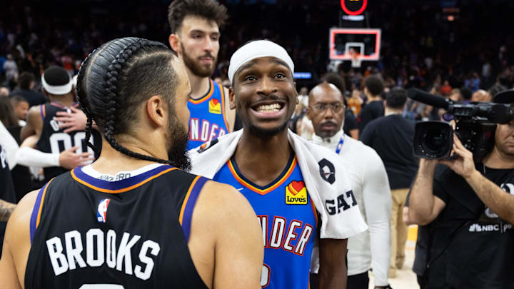 Oklahoma City Thunder guard Shai Gilgeous-Alexander greets Phoenix Suns forward Dillon Brooks (3) after advancing in a four game sweep of the first round of the 2026 NBA Playoffs at Mortgage Matchup Center.