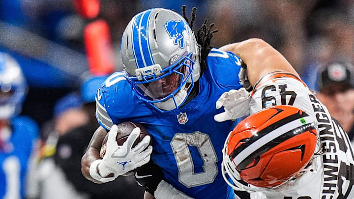 Detroit Lions running back Jahmyr Gibbs (0) runs for a first down against Cleveland Browns linebacker Carson Schwesinger (49) during the second half at Ford Field in Detroit on Sunday, Sept. 28, 2025.