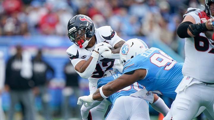Houston Texans running back David Montgomery (32) is tackled by Tennessee Titans linebacker Cody Barton (50) during the first quarter at Nissan Stadium in Nashville, Tenn., Sunday, Oct. 11, 2026. Houston Texans running back David Montgomery (32) is tackled by Tennessee Titans linebacker Cody Barton (50) during the first quarter at Nissan Stadium in Nashville, Tenn., Sunday, Oct. 11, 2026.