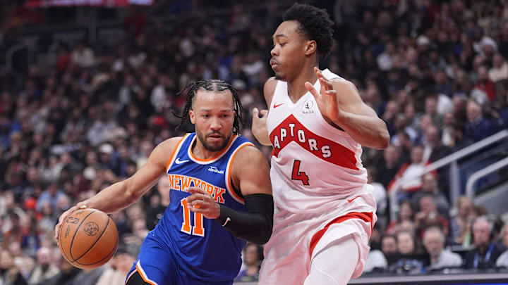 Mar 3, 2026; Toronto, Ontario, CAN; New York Knicks guard Jalen Brunson (11) drives to the basket against Toronto Raptors guard Scottie Barnes (4) during the first half at Scotiabank Arena. Mandatory Credit: John E. Sokolowski-Imagn Images