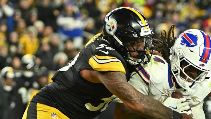 Nov 30, 2025; Pittsburgh, Pennsylvania, USA; Pittsburgh Steelers linebacker Malik Harrison (50) tackles Buffalo Bills running back James Cook III (4) during the second half at Acrisure Stadium. Mandatory Credit: Barry Reeger-Imagn Images