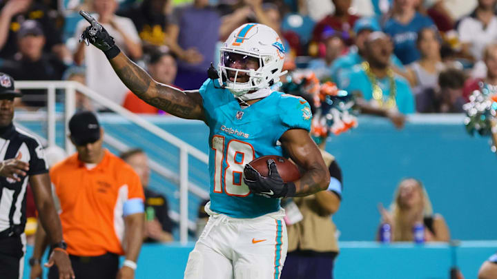 Aug 17, 2024; Miami Gardens, Florida, USA; Miami Dolphins wide receiver Erik Ezukanma (18) reacts after catching the football against the Washington Commanders during the third quarter of a preseason game at Hard Rock Stadium. Mandatory Credit: Sam Navarro-Imagn Images