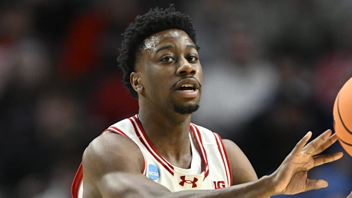 Mar 19, 2026; Portland, OR, USA; Wisconsin Badgers guard John Blackwell (25) passes against the High Point Panthers during the first half of a first round game of the men's 2026 NCAA Tournament at Moda Center. Mandatory Credit: Craig Strobeck-Imagn Images