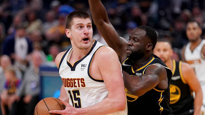 Apr 16, 2022; San Francisco, California, USA; Denver Nuggets center Nikola Jokic (15) controls the ball against Golden State Warriors forward Draymond Green (23) in the second quarter during game one of the first round for the 2022 NBA playoffs at the Chase Center. Mandatory Credit: Cary Edmondson-USA TODAY Sports Apr 16, 2022; San Francisco, California, USA; Denver Nuggets center Nikola Jokic (15) controls the ball against Golden State Warriors forward Draymond Green (23) in the second quarter during game one of the first round for the 2022 NBA playoffs at the Chase Center. Mandatory Credit: Cary Edmondson-USA TODAY Sports