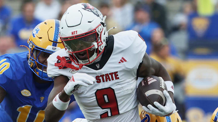 Oct 25, 2025; Pittsburgh, Pennsylvania, USA;  North Carolina State Wolfpack wide receiver Terrell Anderson (9) runs with the ball after a catch against the Pittsburgh Panthers during the first quarter at Acrisure Stadium. Mandatory Credit: Charles LeClaire-Imagn Images