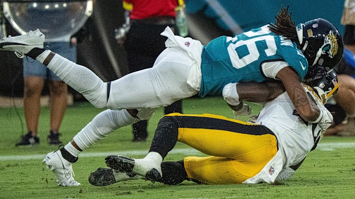 Jacksonville Jaguars safety Antonio Johnson (26) tackles Pittsburgh Steelers running back Kaleb Johnson (20) during the first half of the first preseason game where the Jacksonville Jaguars hosted the Pittsburgh Steelers Saturday Aug. 9, 2025, at EverBank Stadium in Jacksonville, Fla. [Doug Engle/Florida Times-Union]