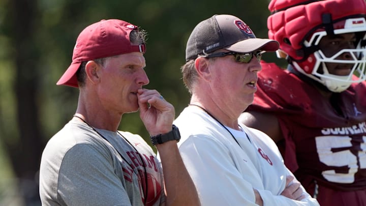 Oklahoma head football coach Brent Venables and Oklahoma offensive line coach Bill Bedenbaugh watch practice during football practice for the University of Oklahoma Sooners in Norman, Okla., Wednesday, Aug., 6, 2025.