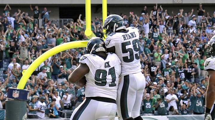 Sep 7, 2014; Philadelphia, PA, USA; Philadelphia Eagles defensive end Fletcher Cox (91) celebrates with DeMeco Ryans (59).