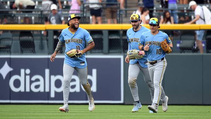 Jun 7, 2026; Denver, Colorado, USA; Milwaukee Brewers outfielder Jackson Chourio (11) celebrates with outfielders Garrett Mitchell (5) and Sal Frelick (10) after a win against the Colorado Rockies at Coors Field. Mandatory Credit: Christopher Hanewinckel-Imagn Images