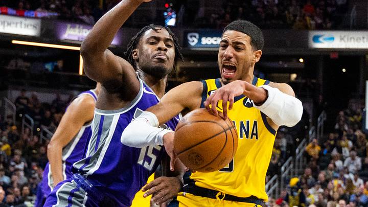 Feb 3, 2023; Indianapolis, Indiana, USA; Indiana Pacers guard Tyrese Haliburton (0) and Sacramento Kings guard Davion Mitchell (15) fight for a loose ball in the first quarter at Gainbridge Fieldhouse. Feb 3, 2023; Indianapolis, Indiana, USA; Indiana Pacers guard Tyrese Haliburton (0) and Sacramento Kings guard Davion Mitchell (15) fight for a loose ball in the first quarter at Gainbridge Fieldhouse.
