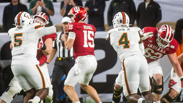 Indiana's Pat Coogan (78), Drew Evans (62), and Carter Smith (65) protect Fernando Mendoza (15) during the College Football Playoff National Championship college football game at Hard Rock Stadium in Miami Gardens on Monday, Jan. 19, 2026.