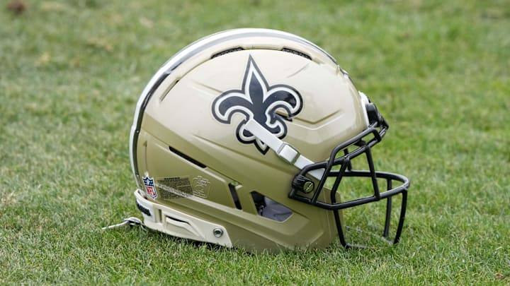 Aug 14, 2025; Carson, CA, USA; A New Orleans Saints helmet on the field during a joint practice against the Los Angeles Rams at the Dignity Health Sports Park. Mandatory Credit: Kirby Lee-Imagn Images