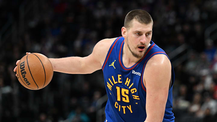 Feb 28, 2025; Detroit, Michigan, USA;  Denver Nuggets center Nikola Jokic (15) gets ready to drive to the basket against the Detroit Pistons  in the first quarter at Little Caesars Arena.