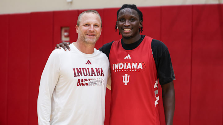 Indiana men's basketball coach Darian DeVries poses with Victor Oladipo at practice July 31 inside Cook Hall in Bloomington.