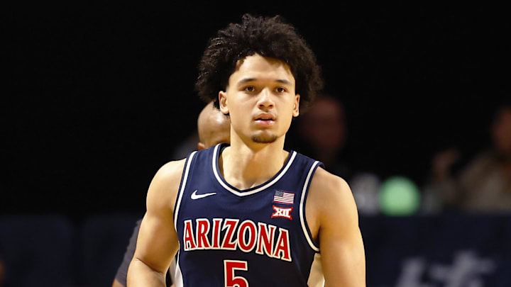 Jan 17, 2026; Orlando, Florida, USA;  Arizona Wildcats guard Brayden Burries (5) dribbles up the court in the second half against the Central Florida Knights at Addition Financial Arena. Mandatory Credit: Russell Lansford-Imagn Images
