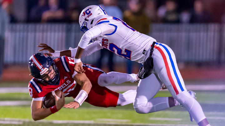 A John Curtis defender makes the tackle on Teurlings Catholic QB Alex Munoz