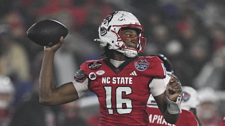 Dec 28, 2024; Annapolis, MD, USA;  North Carolina State Wolfpack quarterback CJ Bailey (16) throws from the pocket during the first half of the the Go Bowling Military Bowl against the East Carolina Pirates at Navy-Marine Corps Memorial Stadium. Mandatory Credit: Tommy Gilligan-Imagn Images