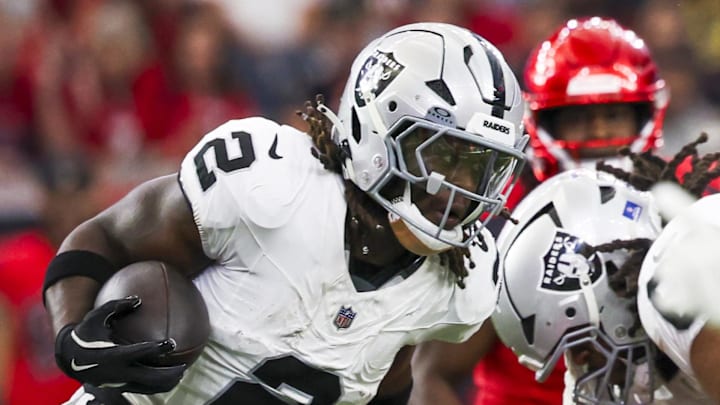 Dec 21, 2025; Houston, Texas, USA; Las Vegas Raiders running back Ashton Jeanty (2) rushes against the Houston Texans during the first quarter at NRG Stadium. Mandatory Credit: Thomas Shea-Imagn Images