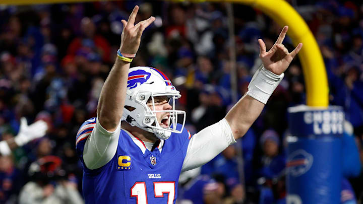 Buffalo Bills quarterback Josh Allen celebrates with fans after his 81-yard touchdown pass to receiver Khalil Shakir