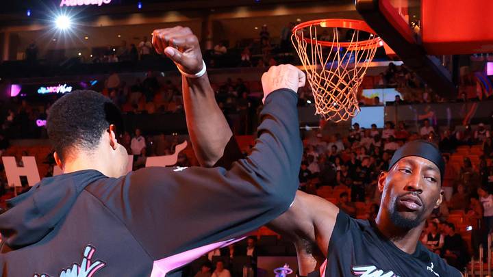 Mar 30, 2026; Miami, Florida, USA; Miami Heat center Bam Adebayo (13) and center Kel'el Ware (7) lock arms during player introductions before the game against the Philadelphia 76ers at Kaseya Center. Mandatory Credit: Sam Navarro-Imagn Images