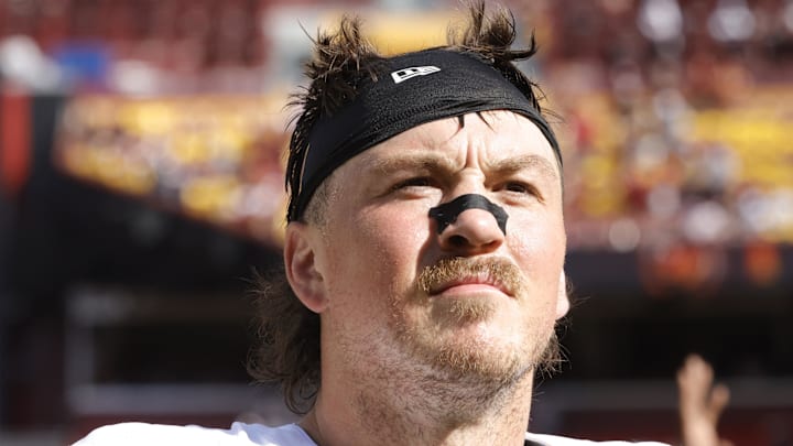 Washington Commanders tight end John Bates walks off the field after the game against the New York Giants