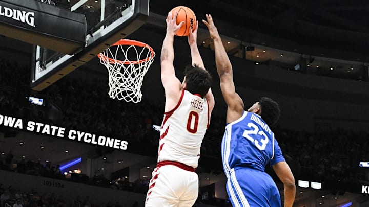 Mar 22, 2026; St. Louis, MO, USA; Iowa State Cyclones guard Nate Heise (0) dunks as Kentucky Wildcats forward Mouhamed Dioubate (23) defends during the second half during a second round game of the men's 2026 NCAA Tournament at Enterprise Center. Mar 22, 2026; St. Louis, MO, USA; Iowa State Cyclones guard Nate Heise (0) dunks as Kentucky Wildcats forward Mouhamed Dioubate (23) defends during the second half during a second round game of the men's 2026 NCAA Tournament at Enterprise Center.