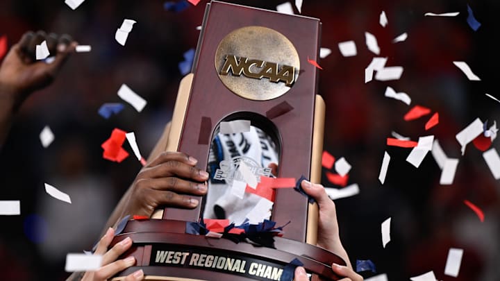 Mar 28, 2026; San Jose, CA, USA; The Arizona Wildcats celebrates with the West Regional Championship trophy after an Elite Eight game against the Purdue Boilermakers of the West Regional of the men's 2026 NCAA Tournament at SAP Center. Mandatory Credit: Eakin Howard-Imagn Images