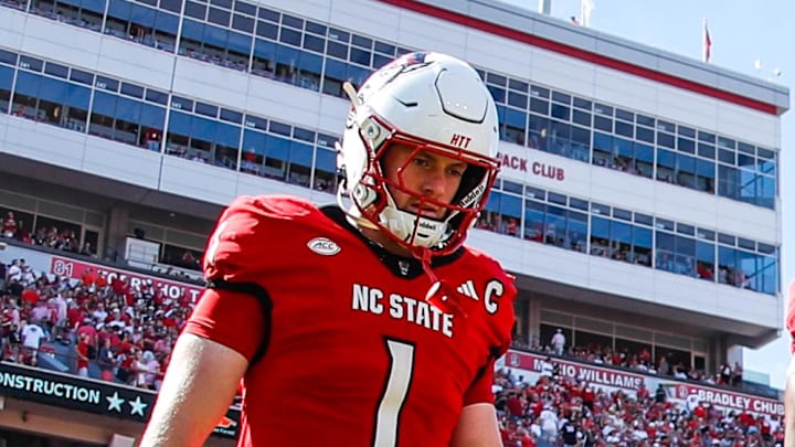 Oct 4, 2025; Raleigh, North Carolina, USA; NC State Wolfpack quarterback CJ Bailey (11), linebacker Caden Fordham (1), wide receiver Keenan Jackson (8) and offensive lineman Jr. Anthony Carter (75) walk out for the coin toss prior to the first half of the game against Campbell Fighting Camels at Carter-Finley Stadium. Mandatory Credit: Jaylynn Nash-Imagn Images Oct 4, 2025; Raleigh, North Carolina, USA; NC State Wolfpack quarterback CJ Bailey (11), linebacker Caden Fordham (1), wide receiver Keenan Jackson (8) and offensive lineman Jr. Anthony Carter (75) walk out for the coin toss prior to the first half of the game against Campbell Fighting Camels at Carter-Finley Stadium. Mandatory Credit: Jaylynn Nash-Imagn Images